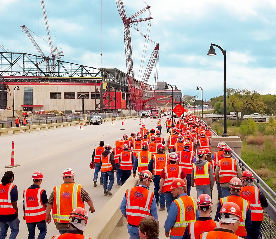 Hundreds of TDIndustries mechanical construction workers head to work at the Globe Life Field project