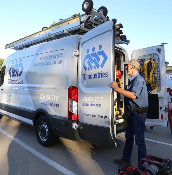 Service and maintenance technician loads tools into TDIndustries truck