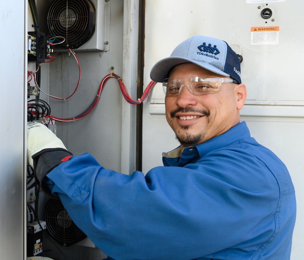 Experienced HVAC Facilities Manager checks HVAC equipment on a rooftop
