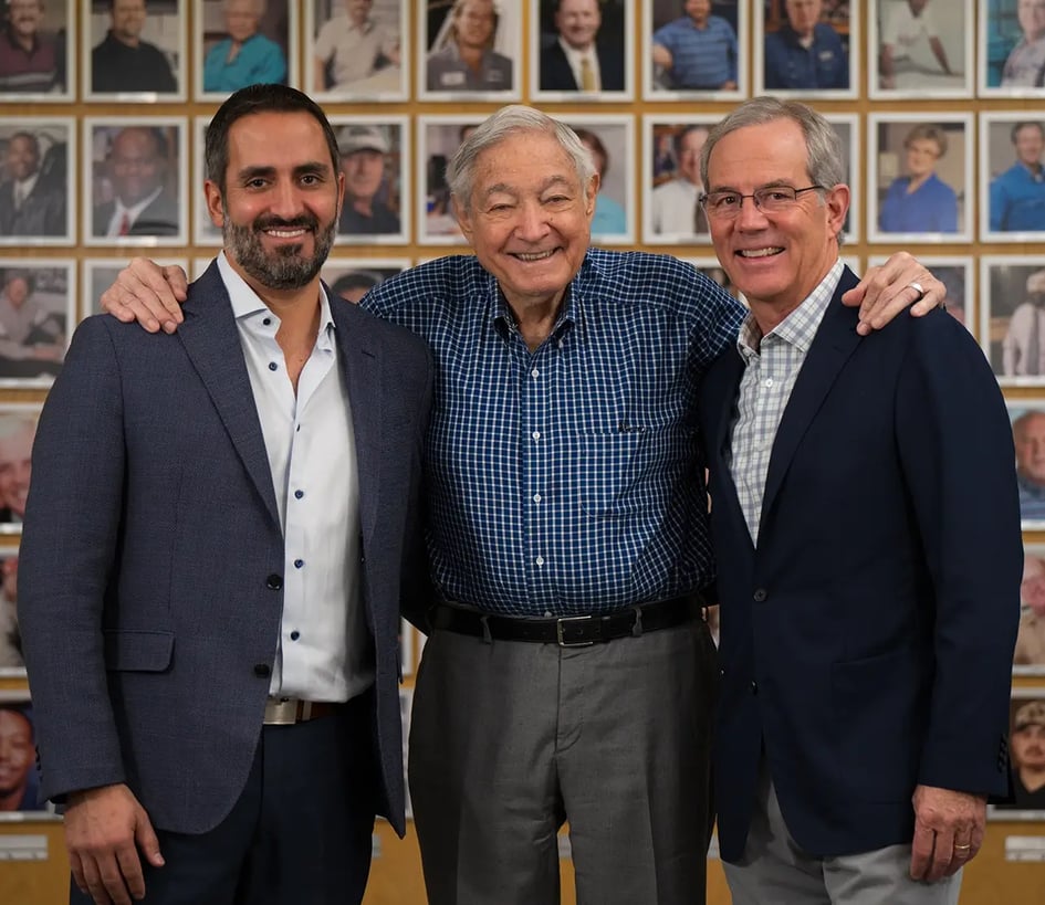 Three TD CEOs pose in front of the legacy wall in Dallas: Frank Musolino, Jack Lowe Jr. and Harold MacDowell