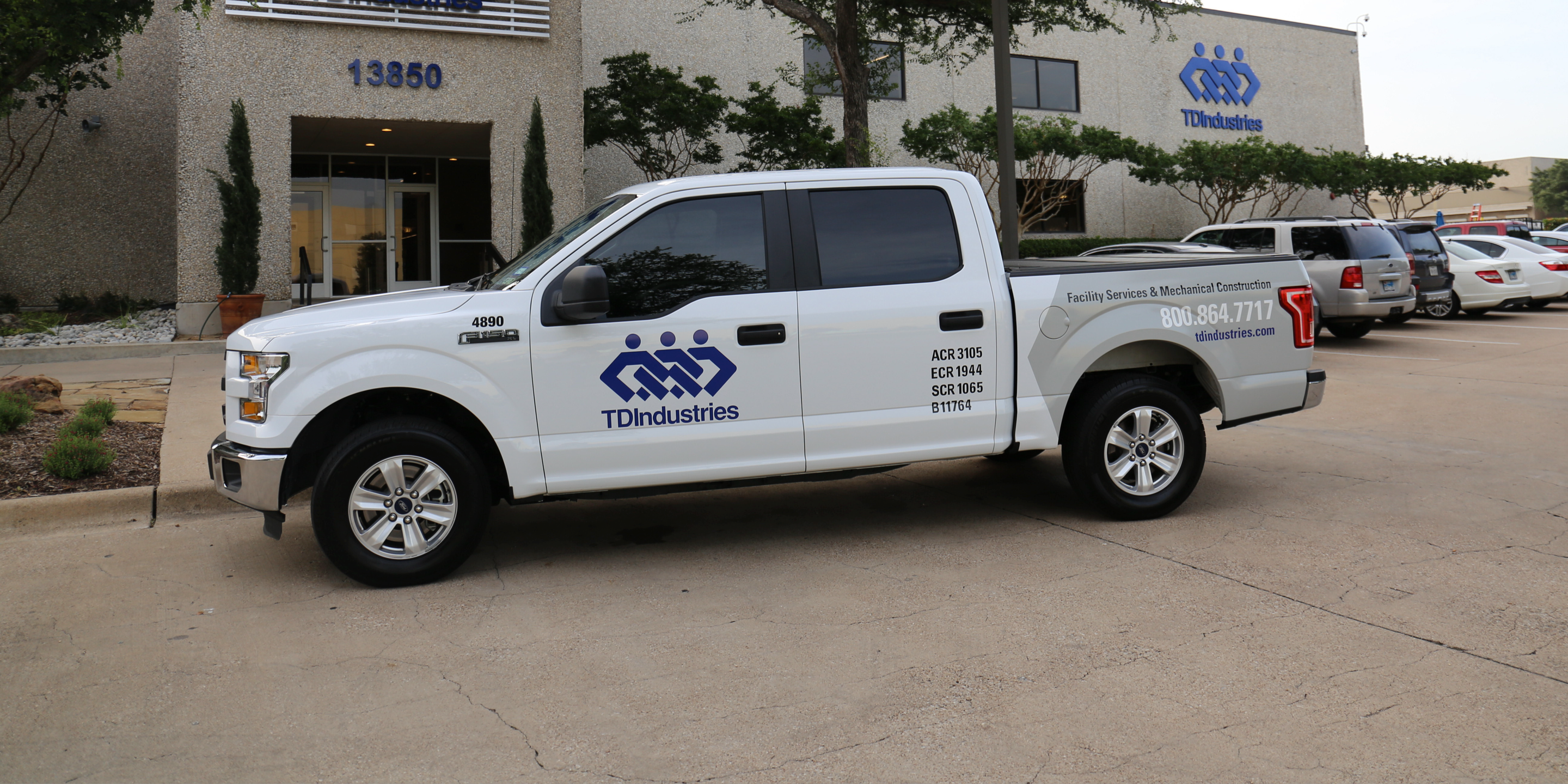 TDIndustries maintenance vehicle parks in front of Dallas headquarters